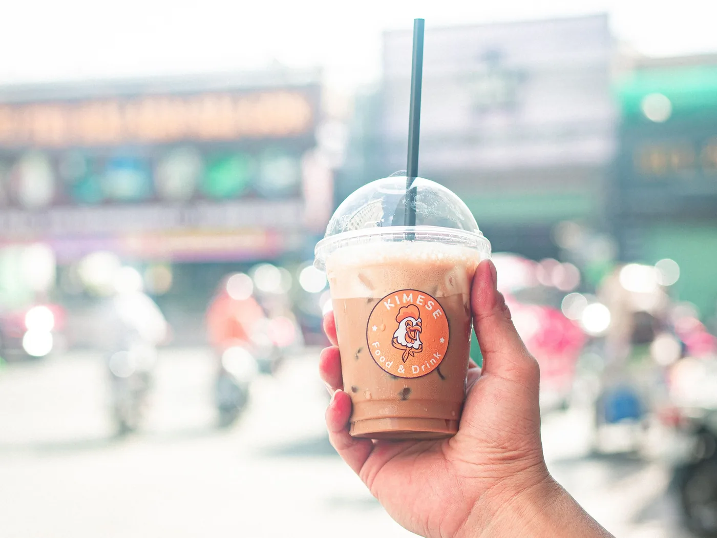 A cup of Vietnamese coffee on a small street-side table